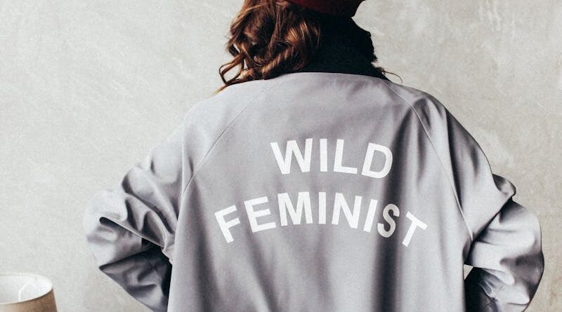 Woman Wearing Red Beret and Gray Long Sleeve Dress with Wild Feminist Print