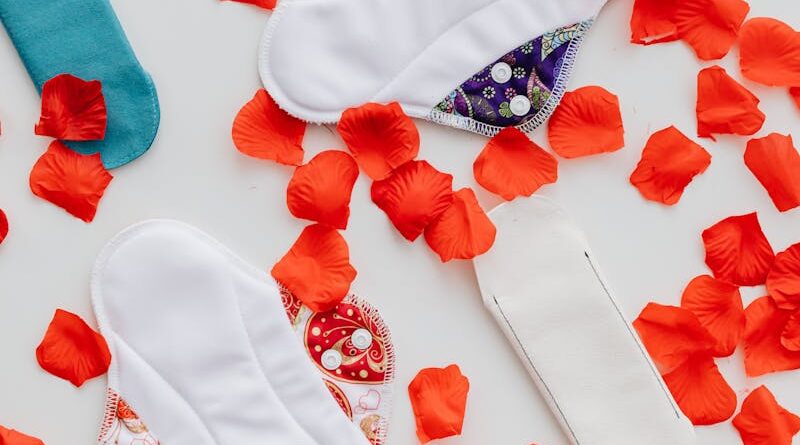 Hygienic Pads and Flowers Petals on White Background